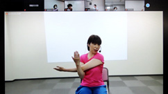 An instructor presents a seminar on stretching exercises designed to prevent back pain and stiff shoulders (held online). 